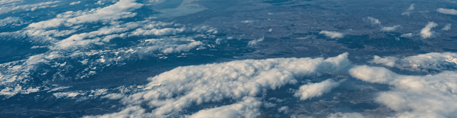 photo from the sky looking at clouds above earth